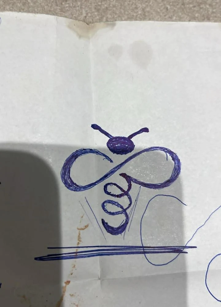 Original notebook drawing in blue pen: a bee-like head above a sideways infinity shape, with a loose spiral descending beneath it.